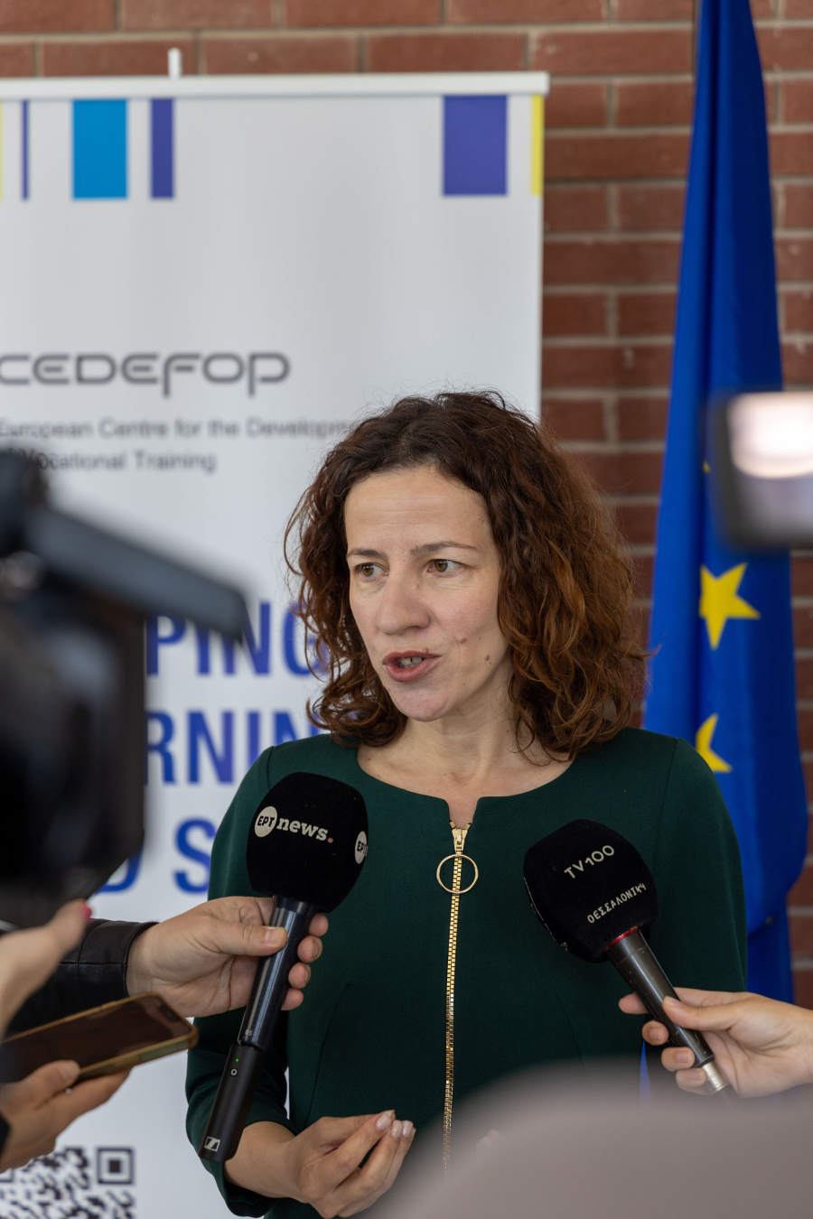 Woman talking to the press