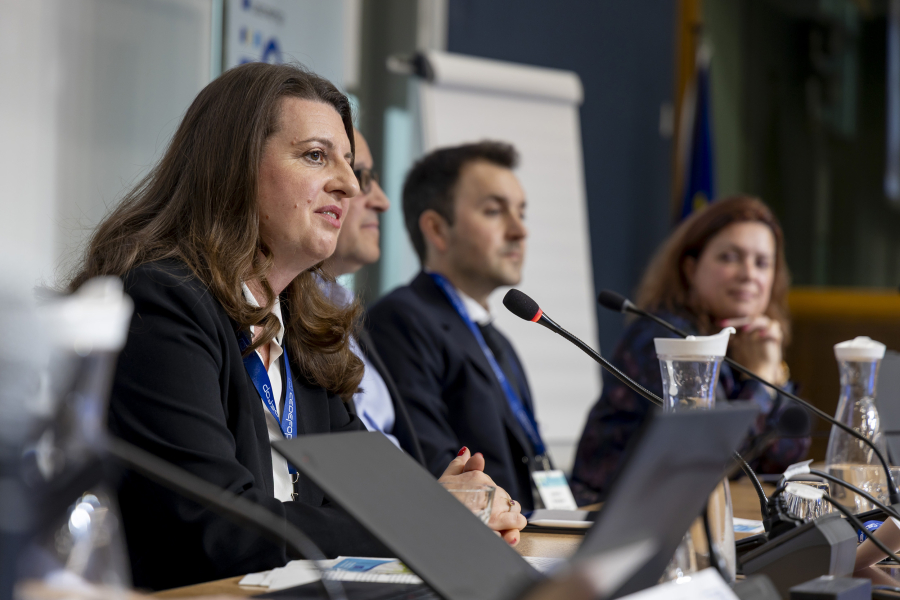 Woman speaking from a panel