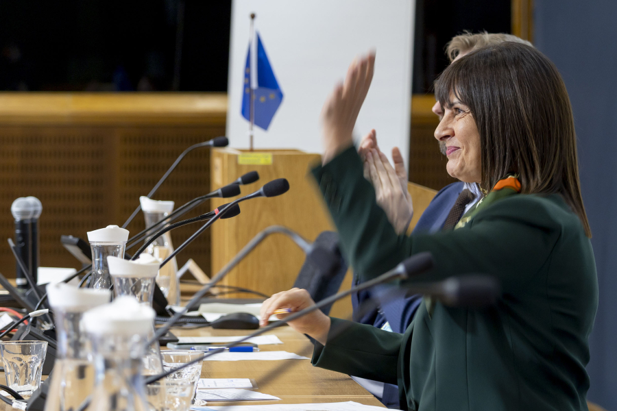 Woman waving from a panel