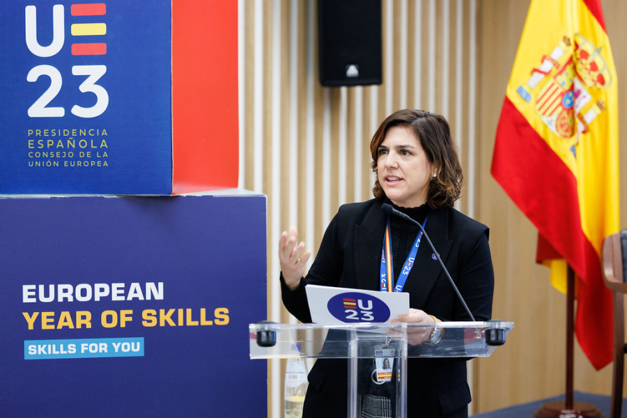 A woman presenting, banners, flags