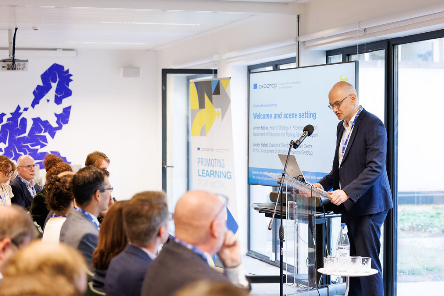 A person standing at a podium giving a presentation